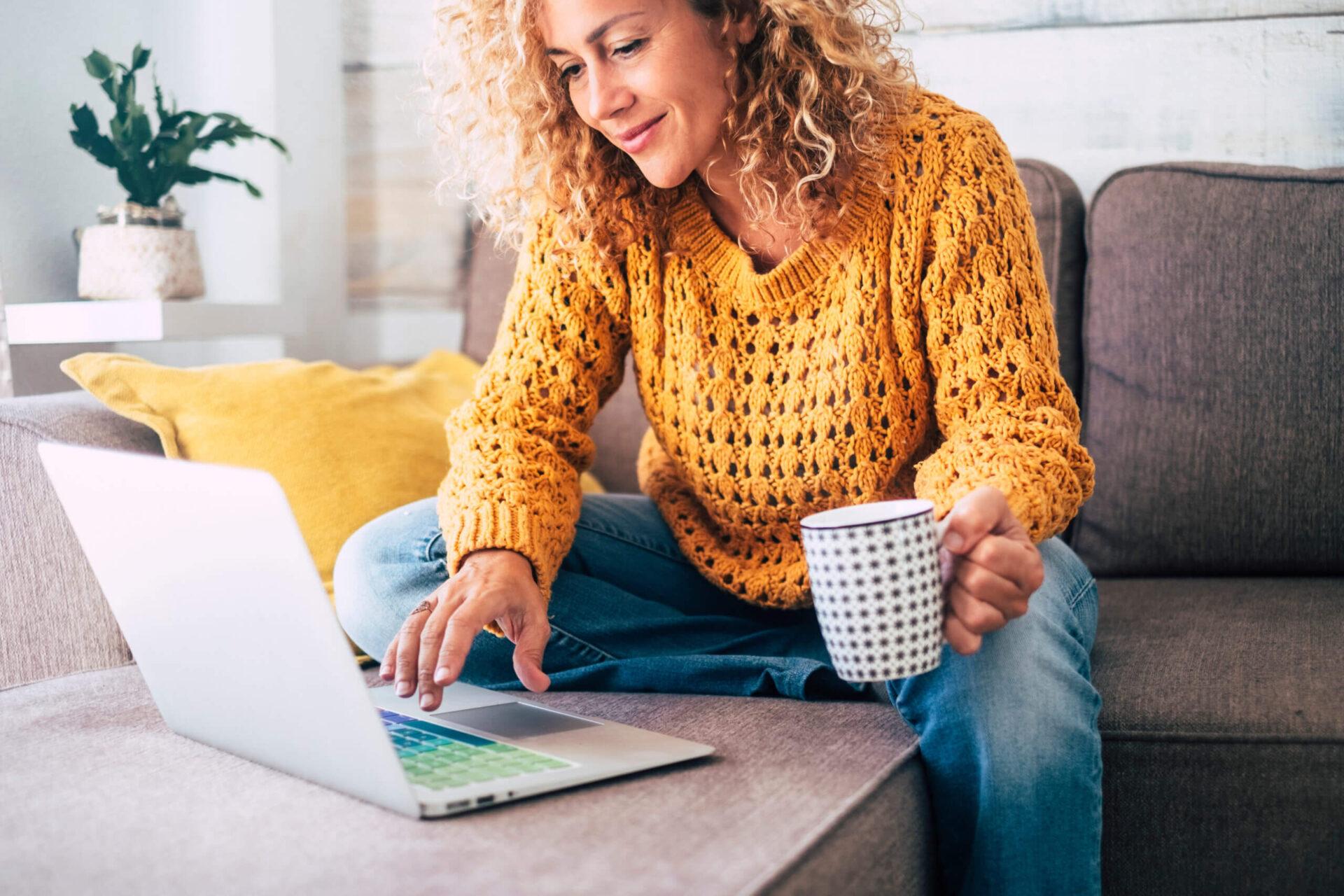 Woman browsing internet on her laptop