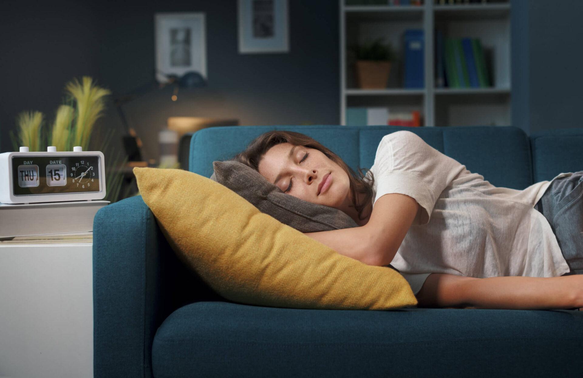 woman sleeping on couch