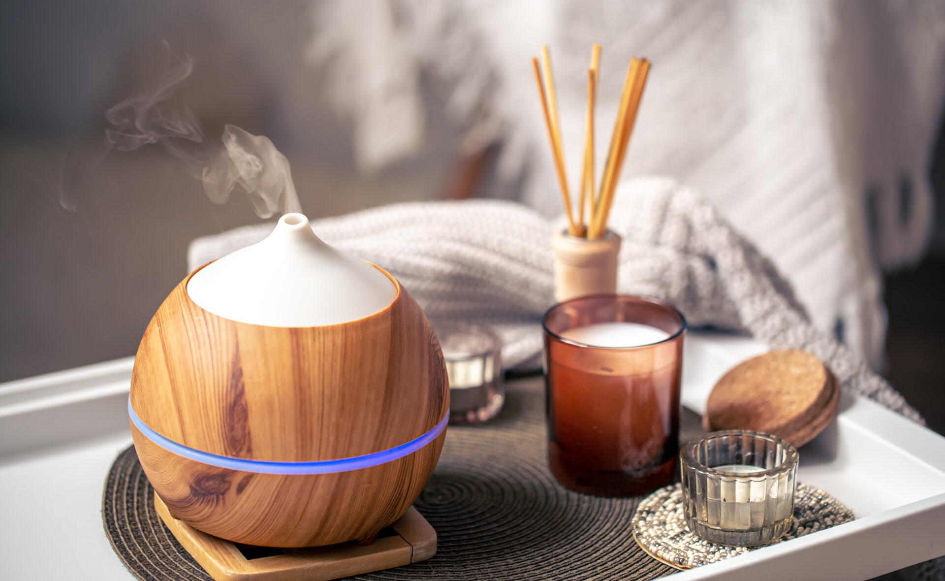Aroma diffuser and candles in a home interior.