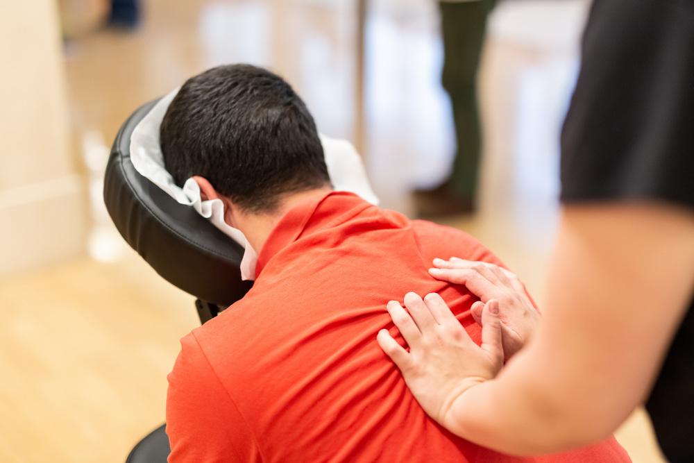 Man receiving massage on a massage chair