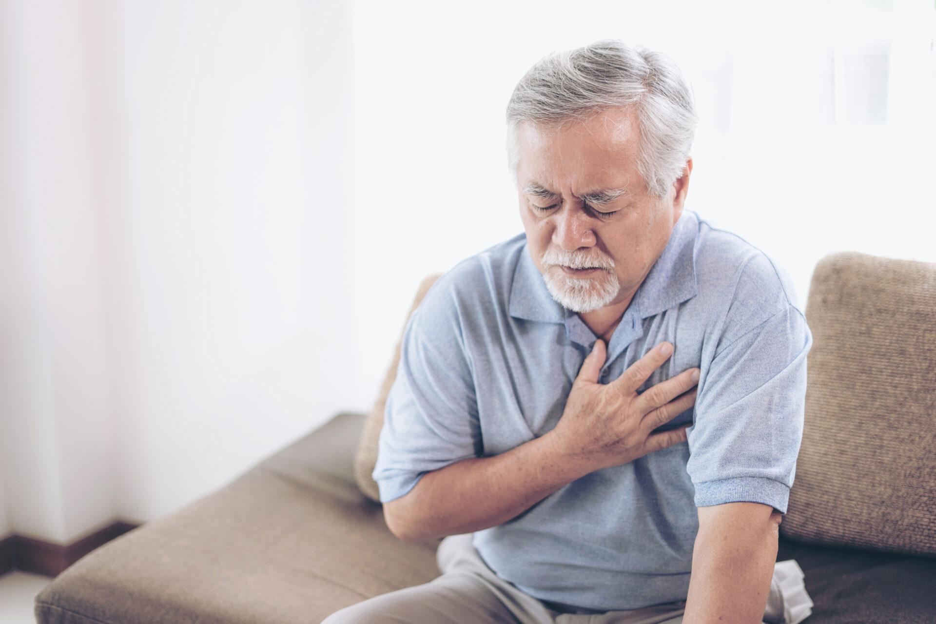 An elderly man experiencing chest discomfort.