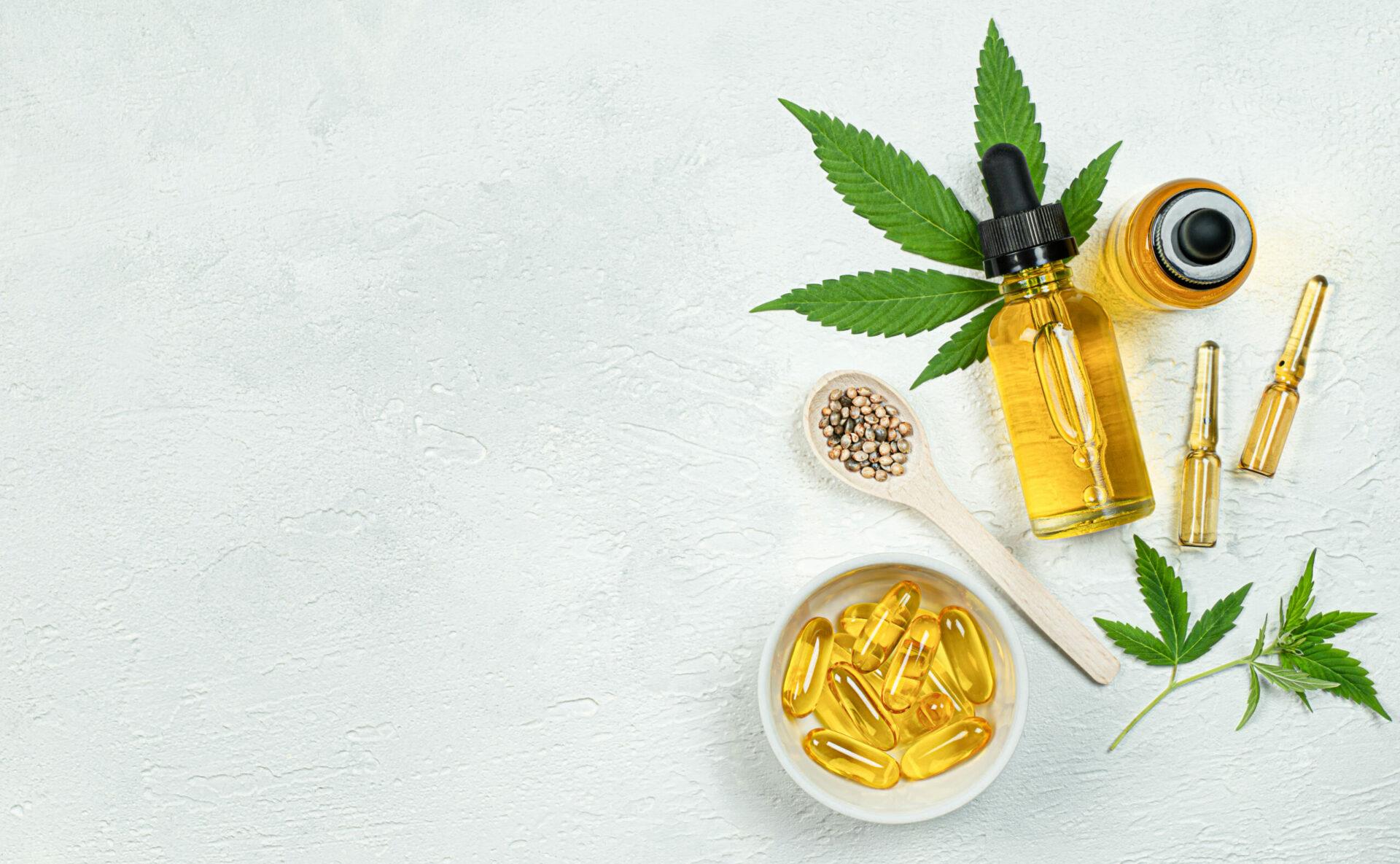 A picture of medical cannabis in different forms from oils to pills, plants and grain.