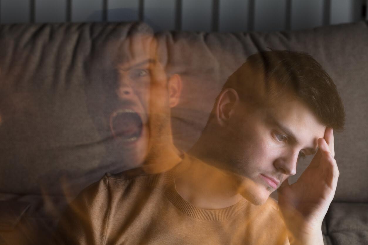A man is sitting on a couch with his head resting on his hand, looking pensive and distressed. Superimposed over this image is a semi-transparent, blurred figure of the same man screaming, symbolising inner turmoil or mental struggle.