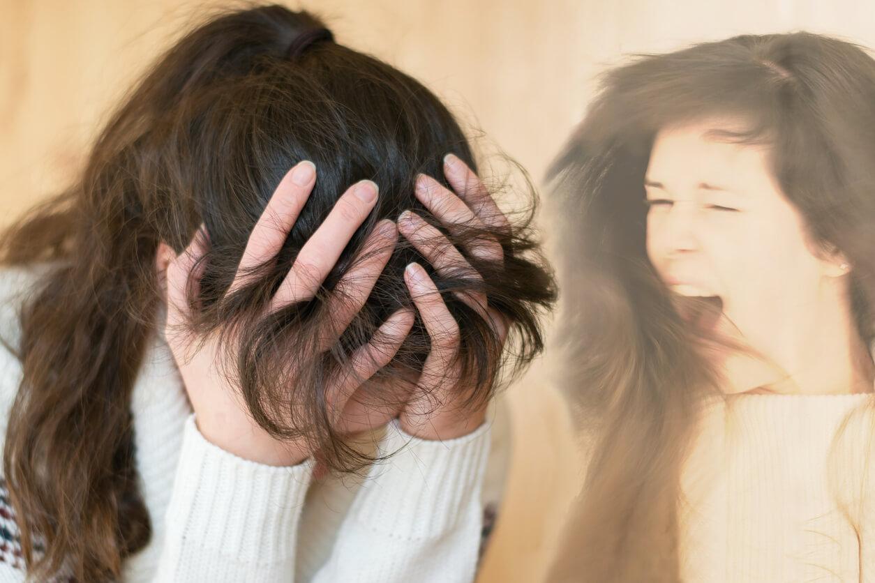 A woman holds her head in distress with her hair covering her face while a faint image of her appears beside her, screaming with her mouth open.
